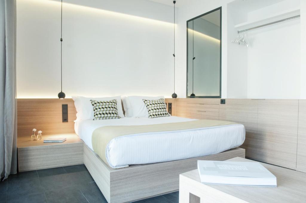 Postel nebo postele na pokoji v ubytování Athens Lodge by Athens Prime Hotels