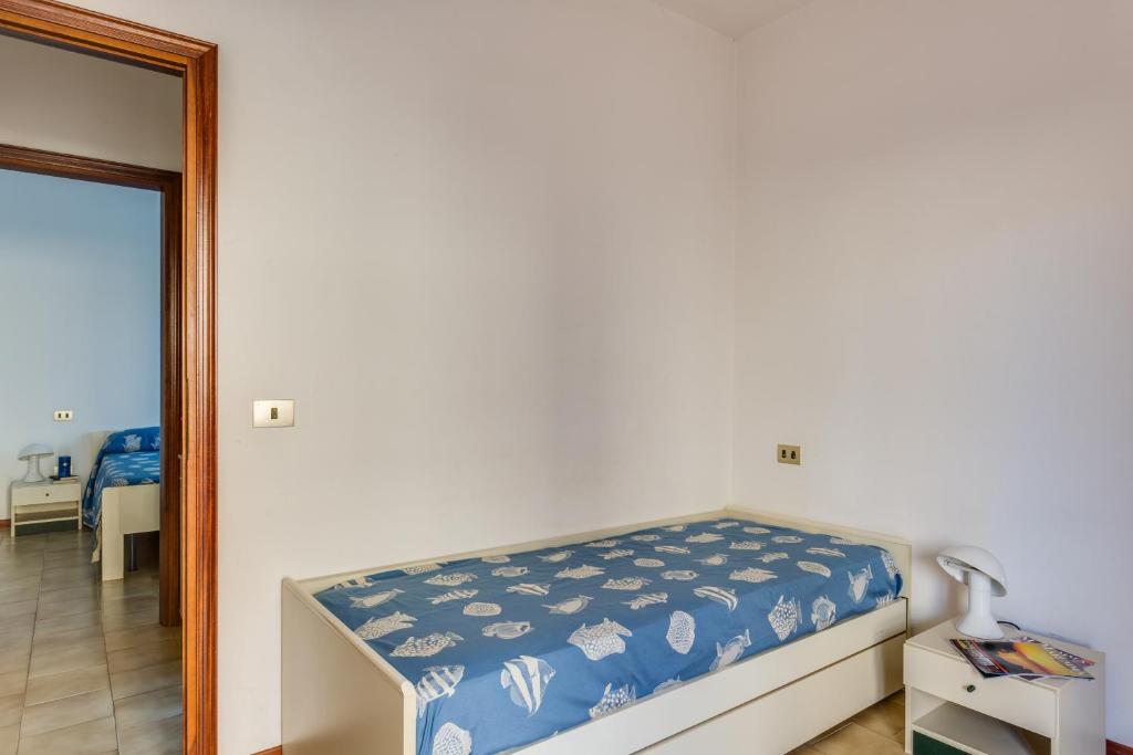 Postel nebo postele na pokoji v ubytování Oltremare Appartamenti