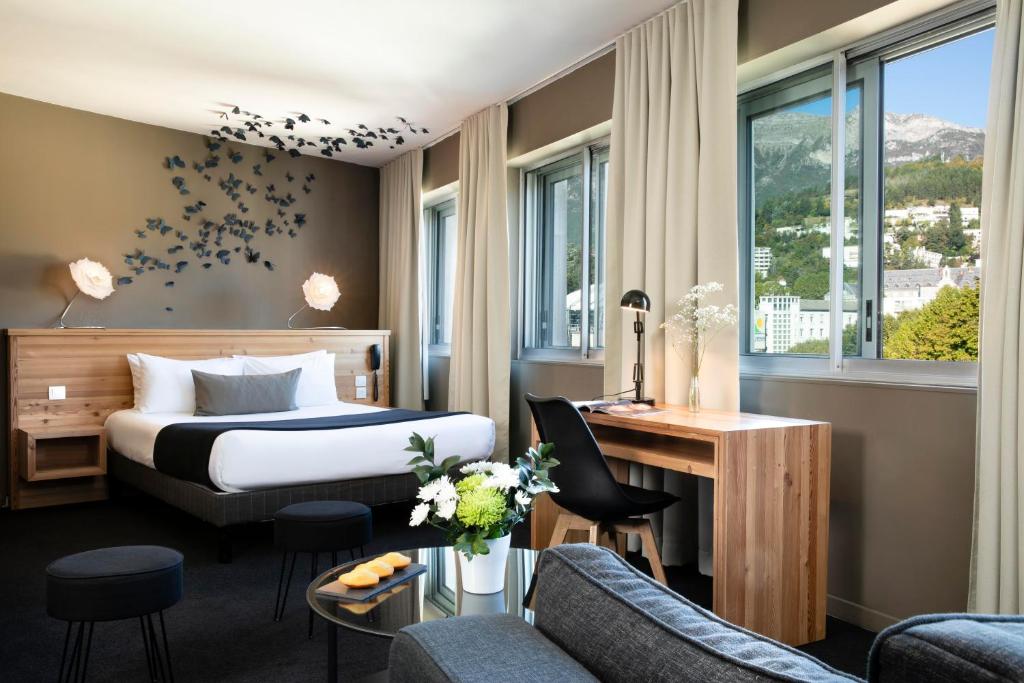 Postel nebo postele na pokoji v ubytování Mon Hotel à Gap
