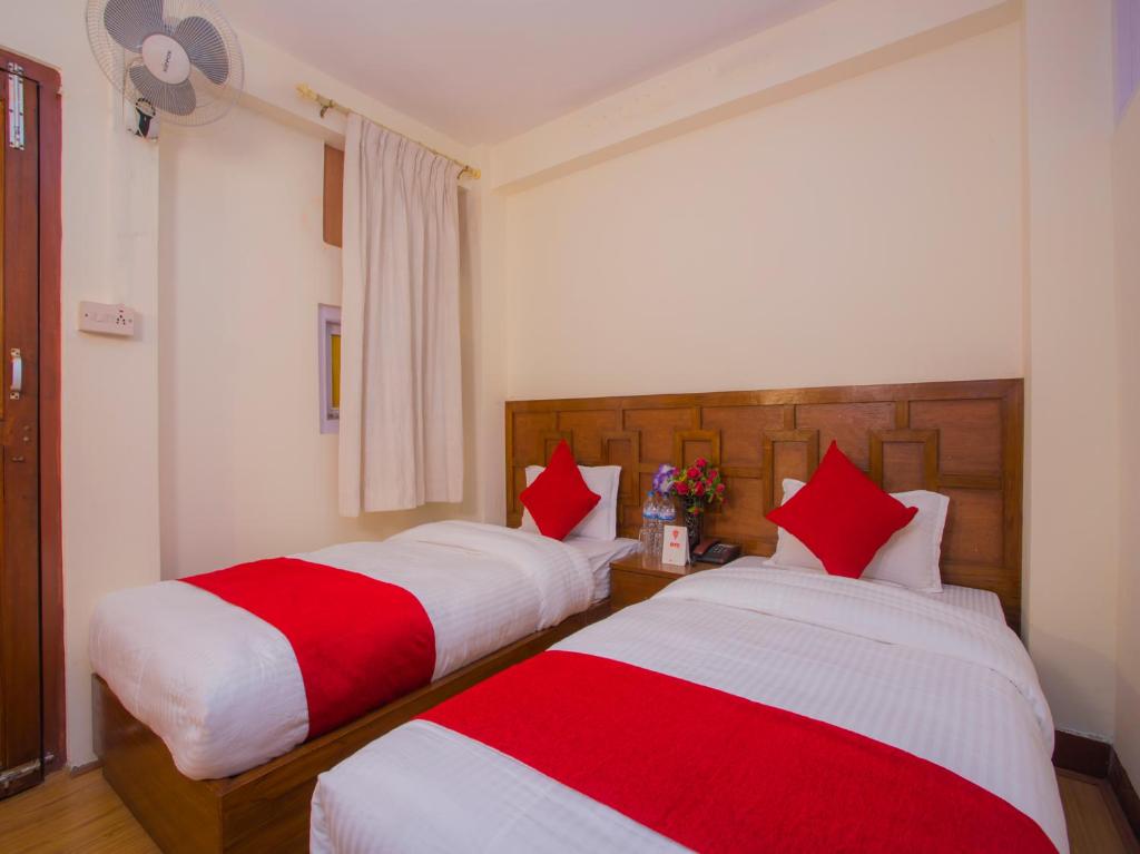 Postel nebo postele na pokoji v ubytování Durbar Guest House