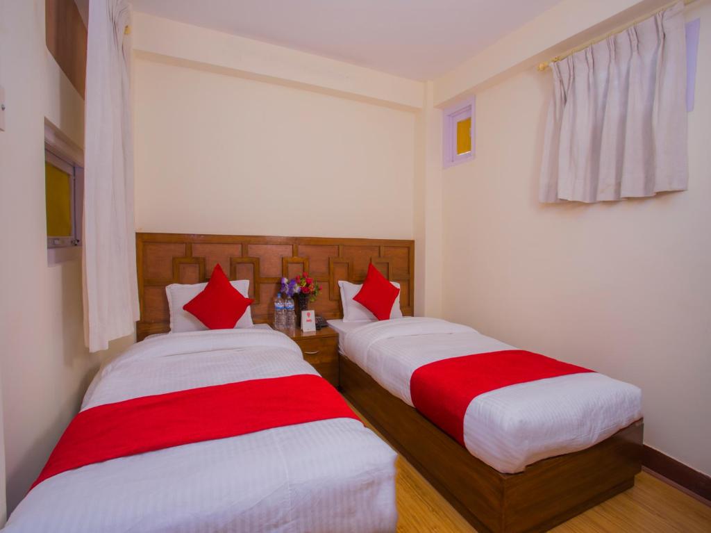 Postel nebo postele na pokoji v ubytování Durbar Guest House