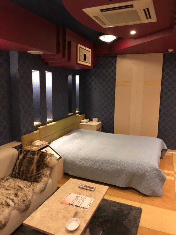 Postel nebo postele na pokoji v ubytování Hotel Charbon (Adult Only)