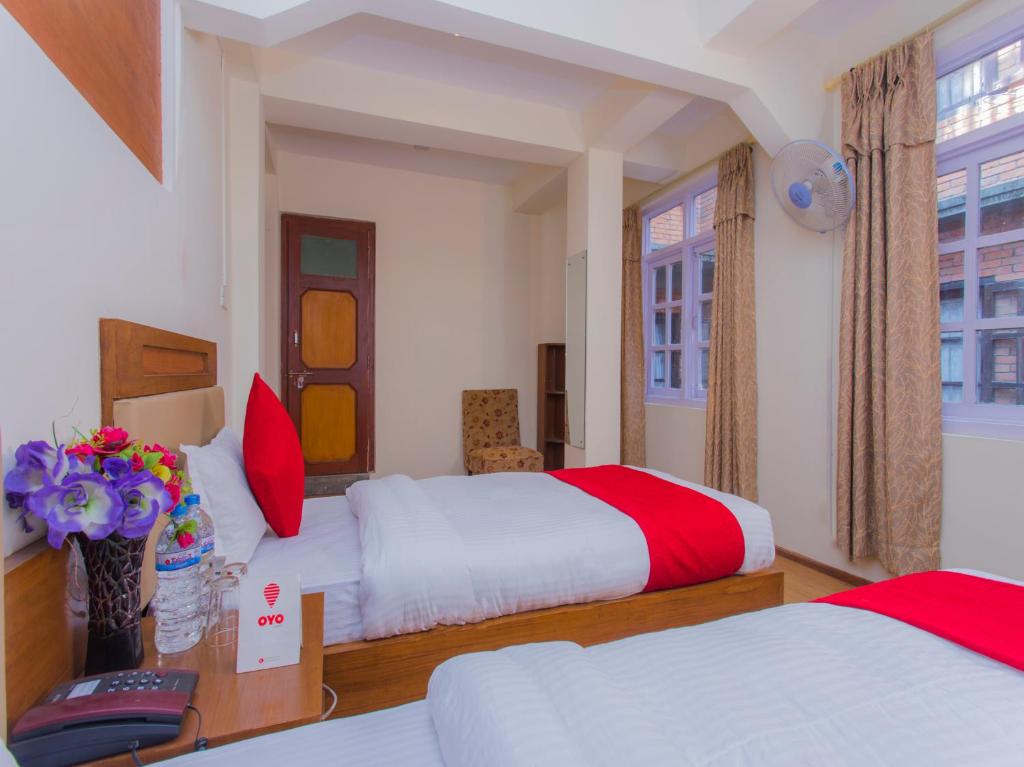 Postel nebo postele na pokoji v ubytování Durbar Guest House