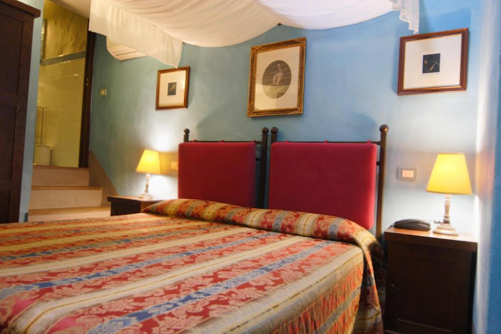 Postel nebo postele na pokoji v ubytování Locanda Viani