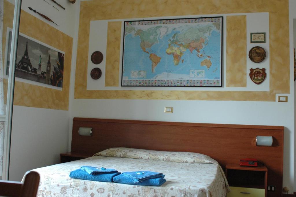 Postel nebo postele na pokoji v ubytování Albergo Astro