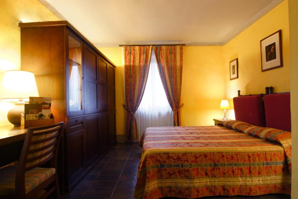 Postel nebo postele na pokoji v ubytování Locanda Viani