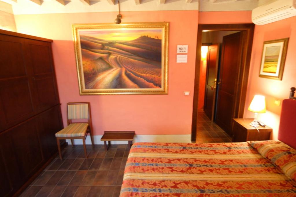 Postel nebo postele na pokoji v ubytování Locanda Viani