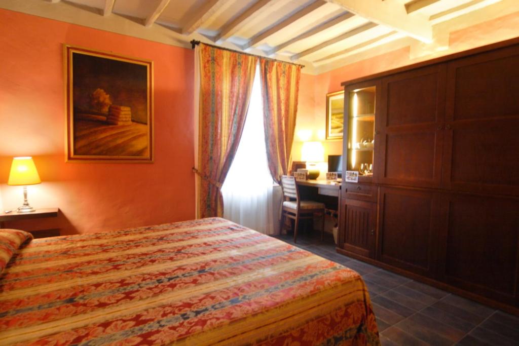 Postel nebo postele na pokoji v ubytování Locanda Viani