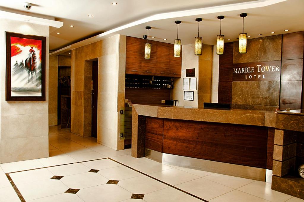a lobby with a bar in a hotel at Marble Tower in Beirut