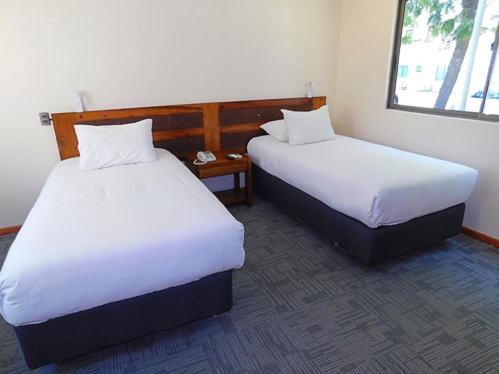 Postel nebo postele na pokoji v ubytování Hotel Mar Andino