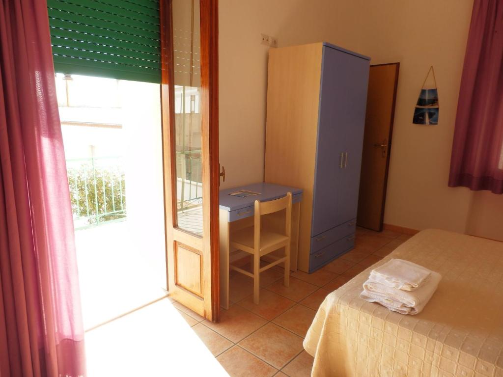 Postel nebo postele na pokoji v ubytování B&B Rose Villa