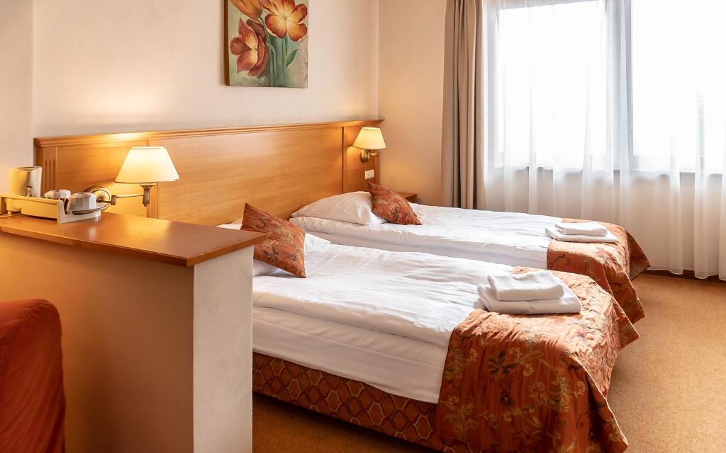 Postel nebo postele na pokoji v ubytování Eco Active Resort PIENINY