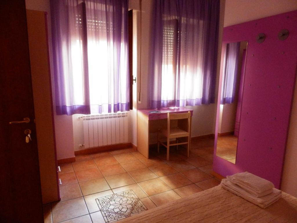 Postel nebo postele na pokoji v ubytování B&B Rose Villa