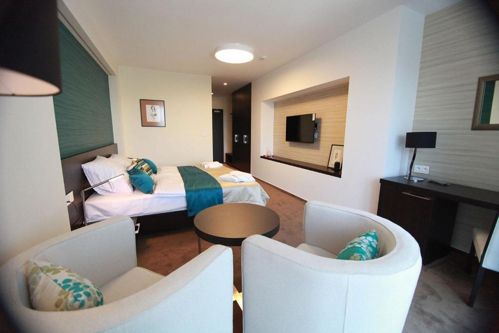 TV a/nebo společenská místnost v ubytování Hotel Zelená Lagúna
