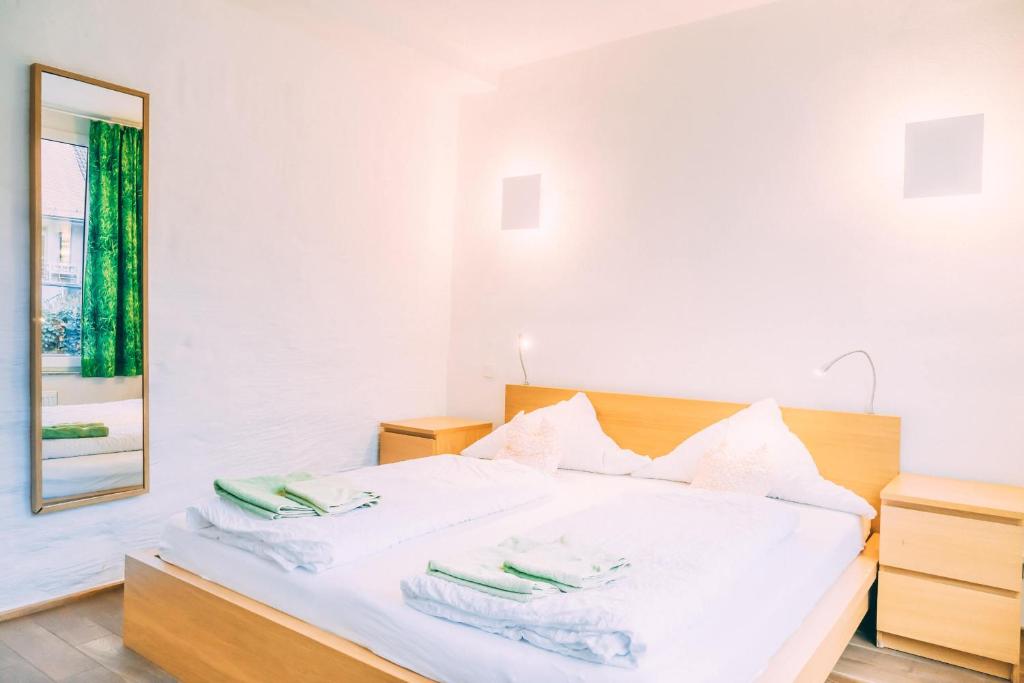 Postel nebo postele na pokoji v ubytování Stadthaus Gut Hügle