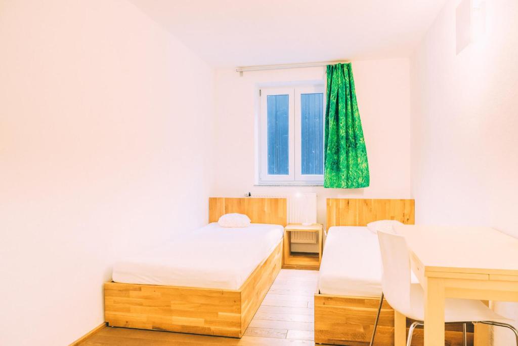Postel nebo postele na pokoji v ubytování Stadthaus Gut Hügle