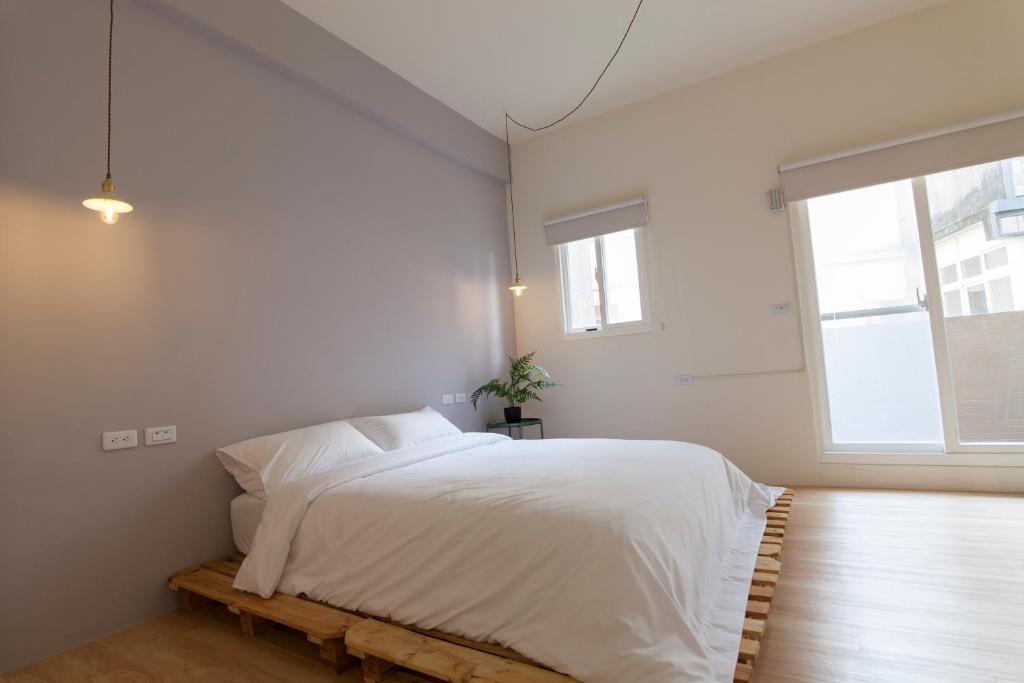Postel nebo postele na pokoji v ubytování 01+ Home