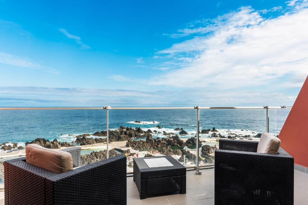 a balcony with a view of the ocean at Aqua Natura Madeira in Porto Moniz