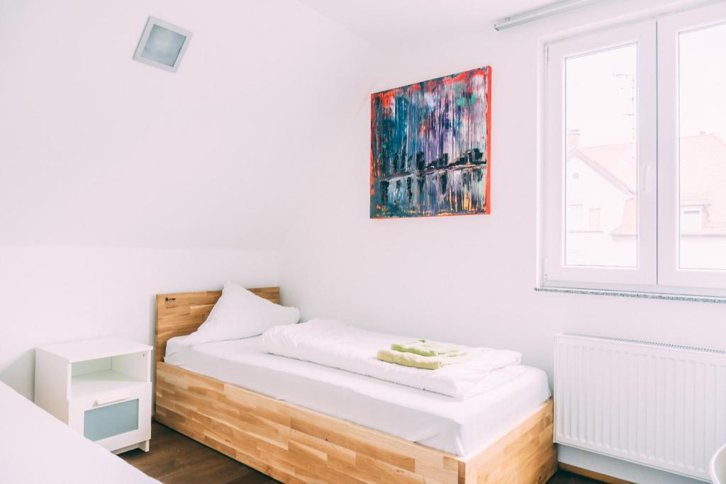 Postel nebo postele na pokoji v ubytování Stadthaus Gut Hügle