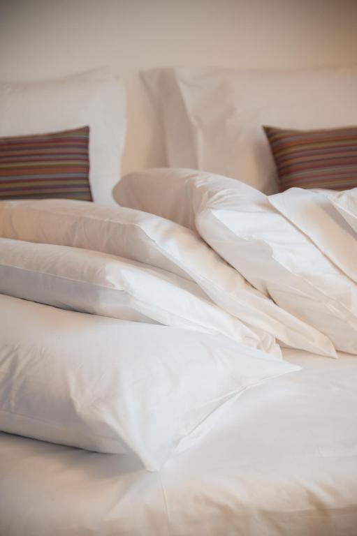 Rúm í herbergi á 8Piuhotel