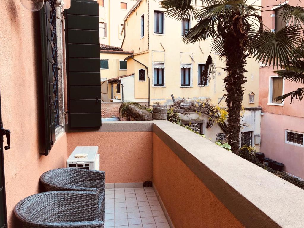 A balcony or terrace at San Marco Design Suites