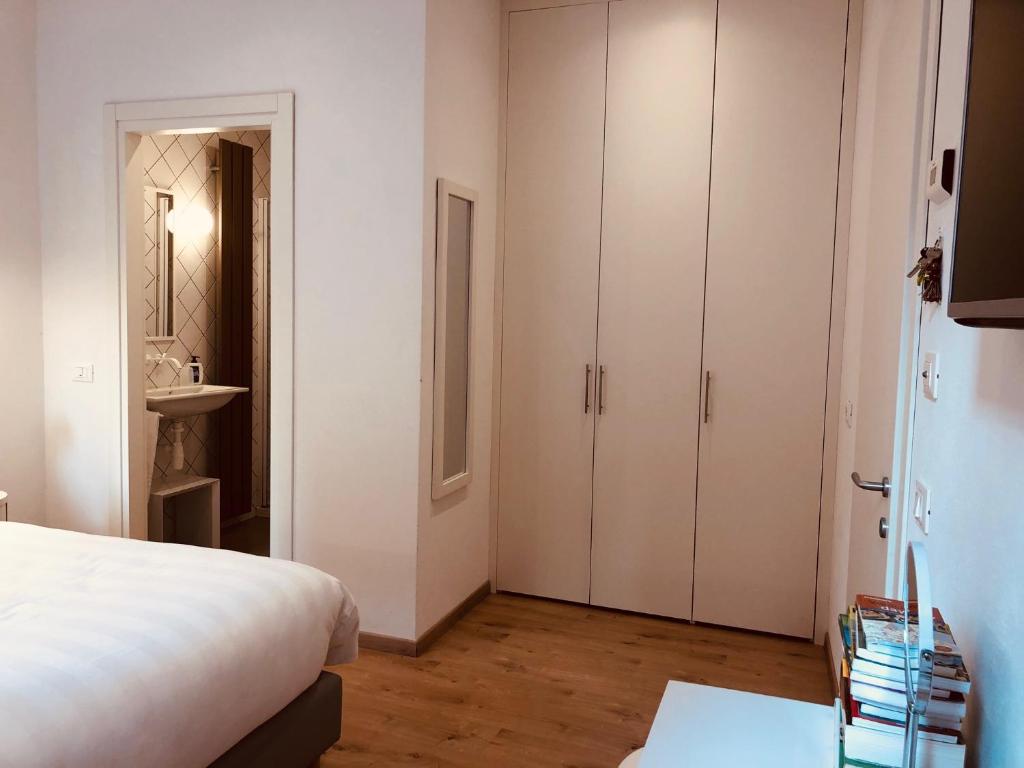 A bed or beds in a room at San Marco Design Suites