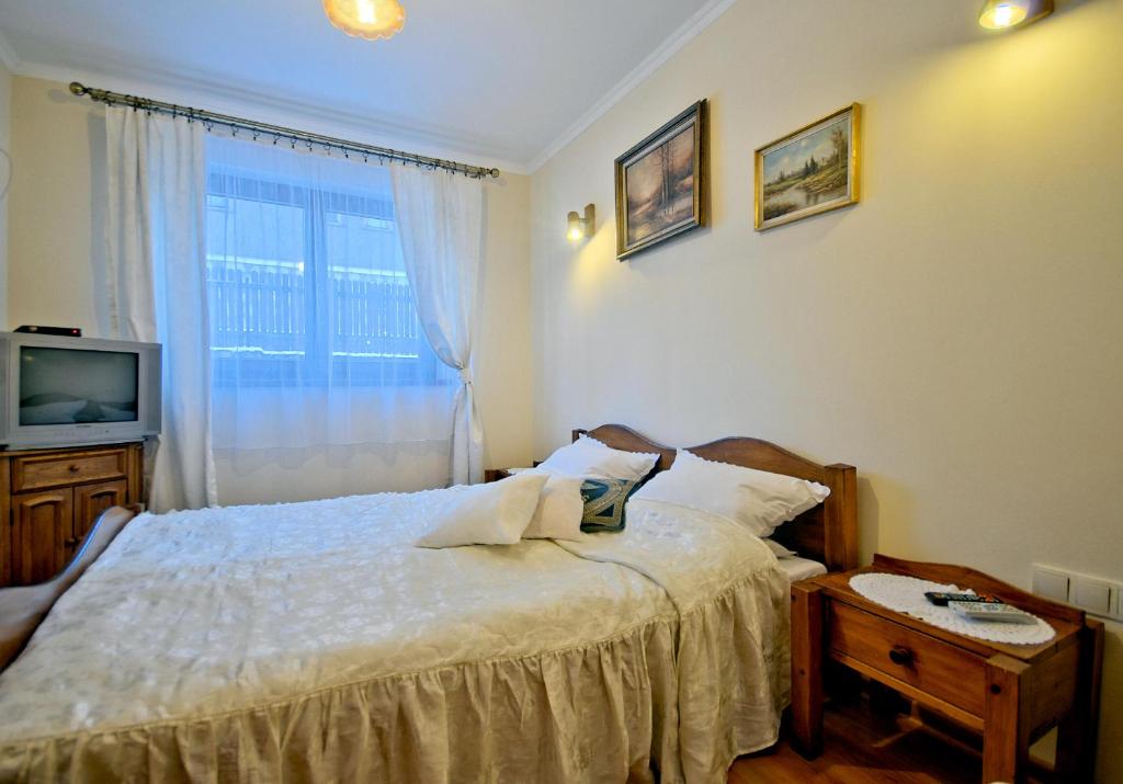 Posteľ alebo postele v izbe v ubytovaní Pokoje u Janka