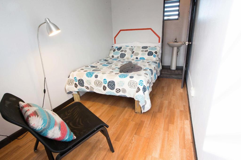 Postel nebo postele na pokoji v ubytování Casa Santurce