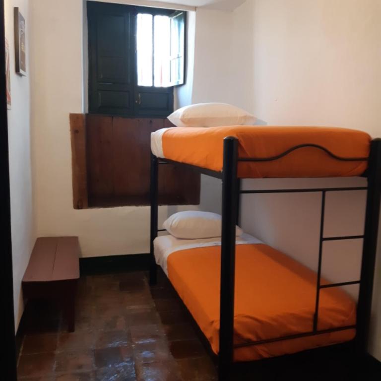 Postel nebo postele na pokoji v ubytování Cedron Hostel