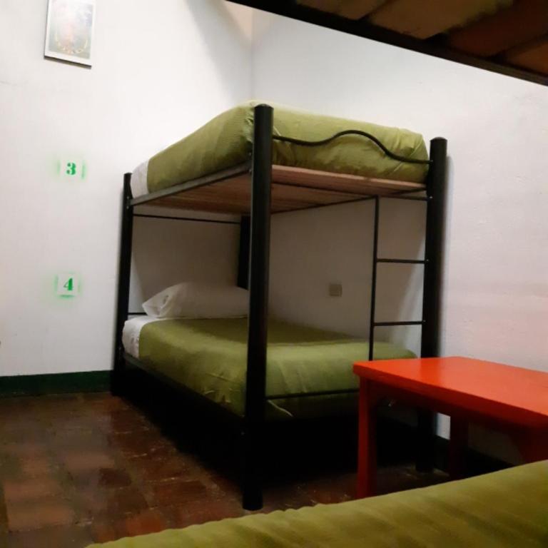 Postel nebo postele na pokoji v ubytování Cedron Hostel