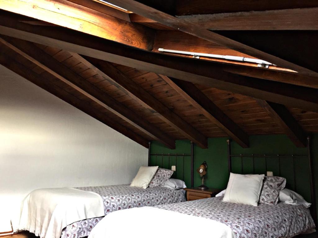Cama o camas de una habitación en Apartamentos Turísticos Reserva de la Biosfera