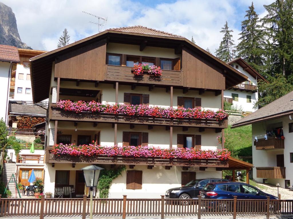 a building with flower boxes on the balconies at CIADIN APPART. in Badia