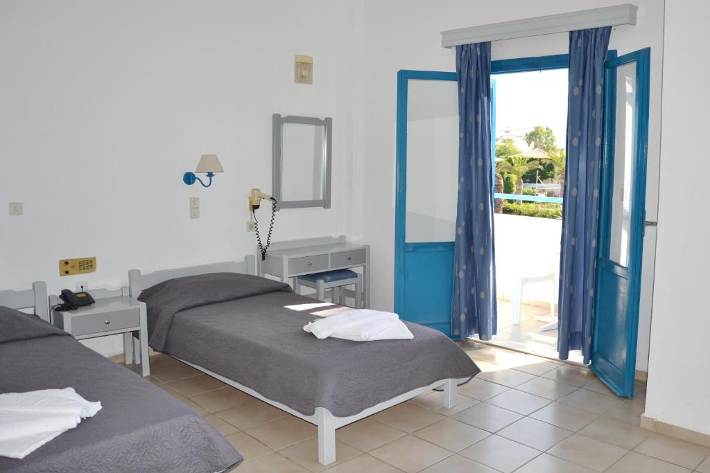 Postel nebo postele na pokoji v ubytování Galeana Beach Hotel