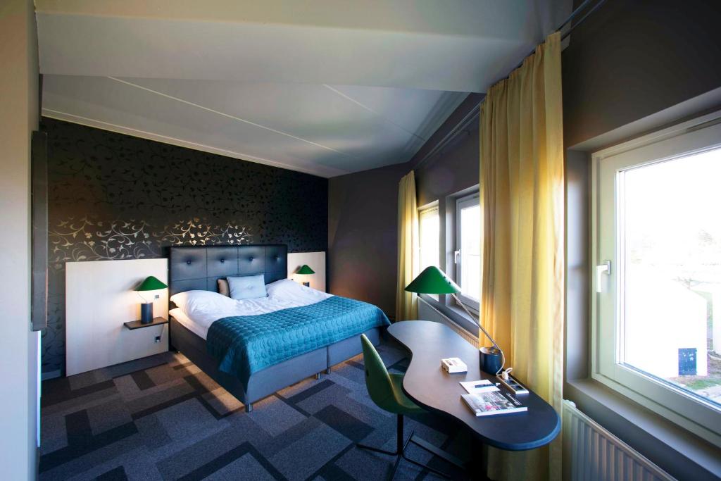 Postel nebo postele na pokoji v ubytování Hotel Lautrup Park