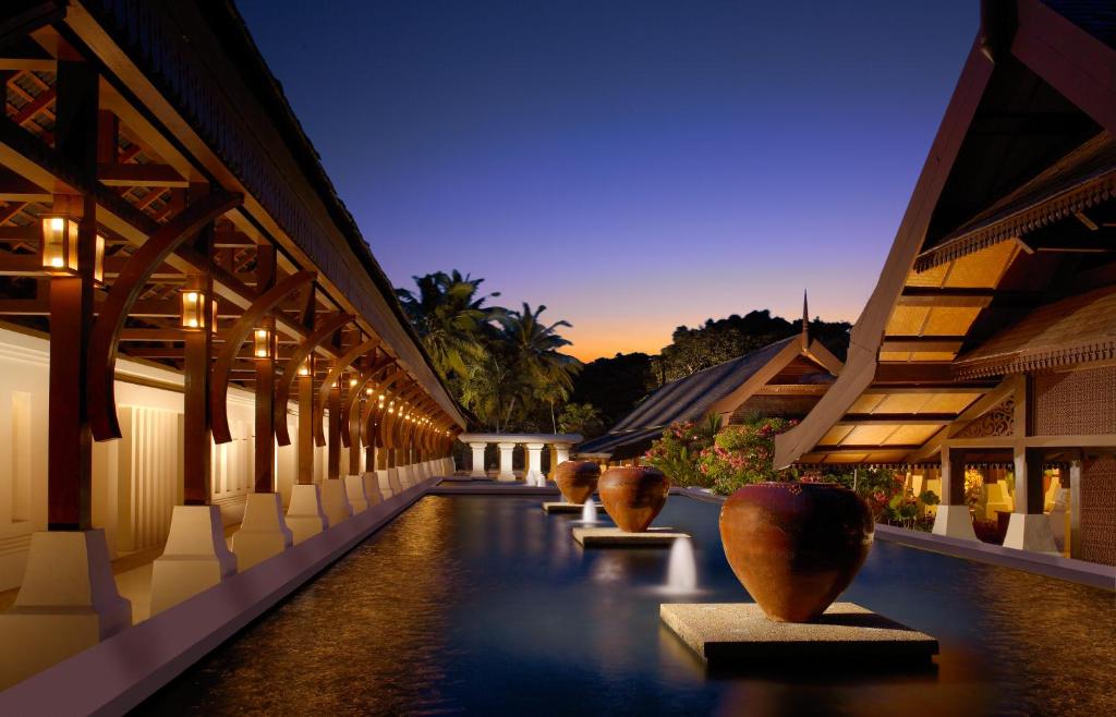 a row of vases sitting on the side of a building at Tanjong Jara Resort - Small Luxury Hotels of the World in Dungun