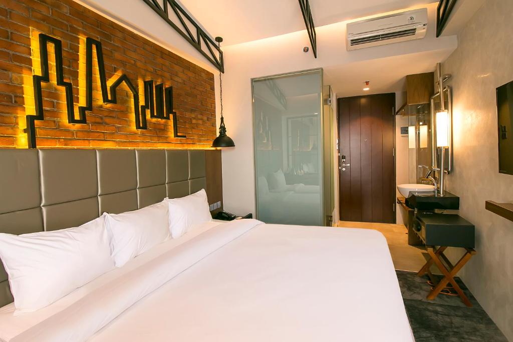 Postel nebo postele na pokoji v ubytování Posto Dormire Hotel