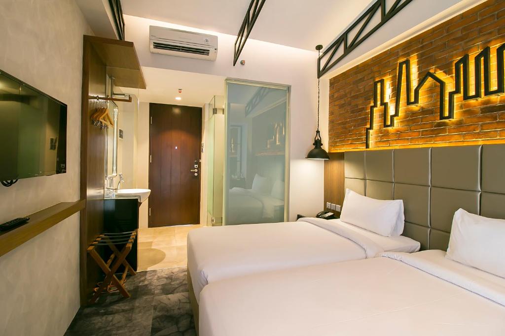 Postel nebo postele na pokoji v ubytování Posto Dormire Hotel