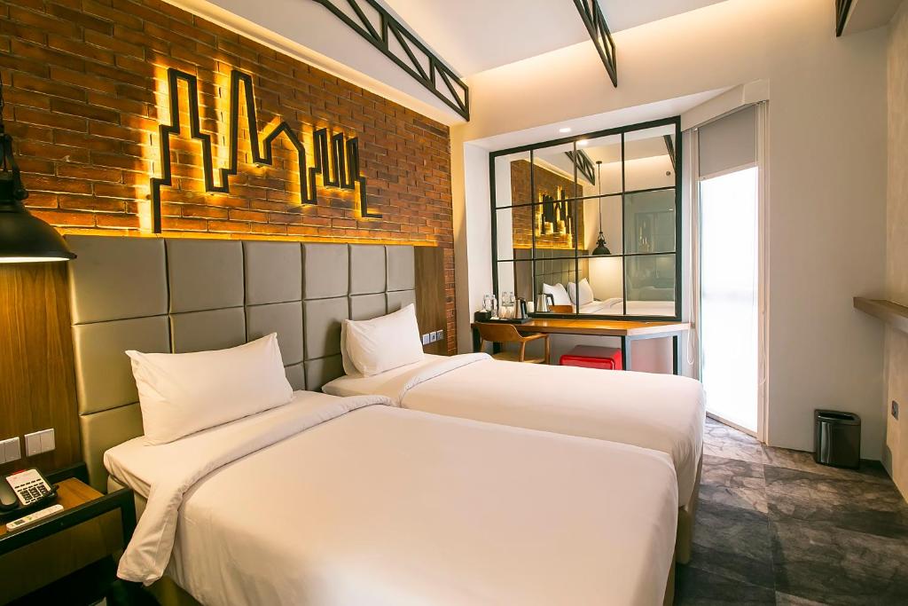 Postel nebo postele na pokoji v ubytování Posto Dormire Hotel