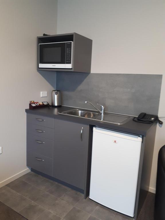 Kuchyň nebo kuchyňský kout v ubytování Northpark Motel