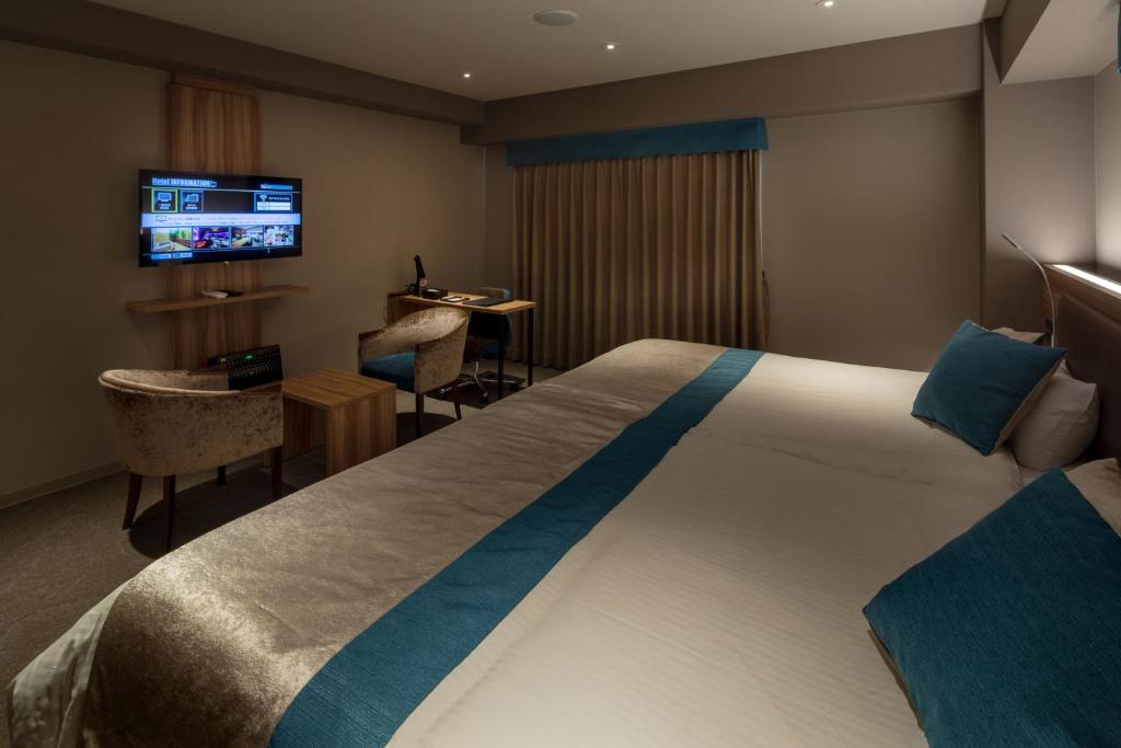 Postel nebo postele na pokoji v ubytování Wat Hotel & Spa Hida Takayama