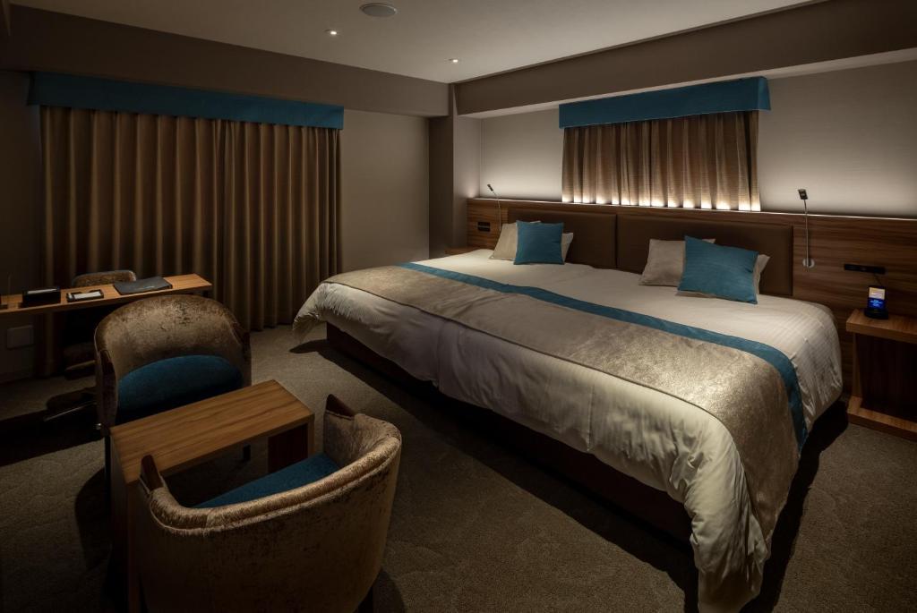 Postel nebo postele na pokoji v ubytování Wat Hotel & Spa Hida Takayama