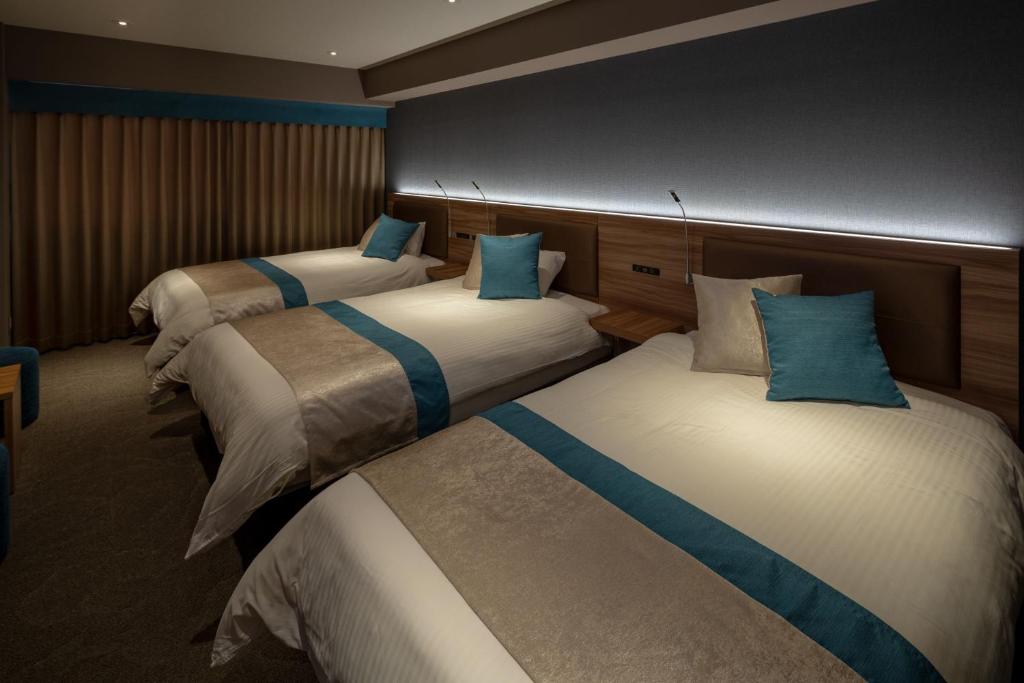 Postel nebo postele na pokoji v ubytování Wat Hotel & Spa Hida Takayama