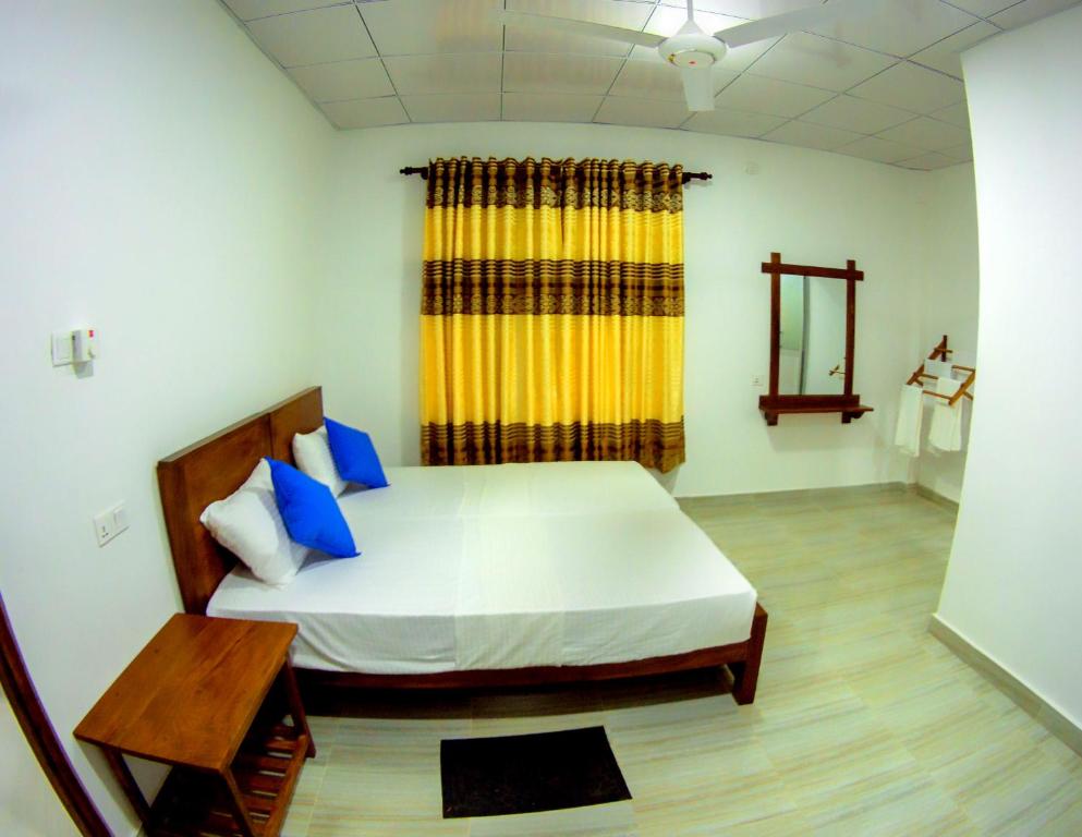 Postel nebo postele na pokoji v ubytování Rock View Home Stay