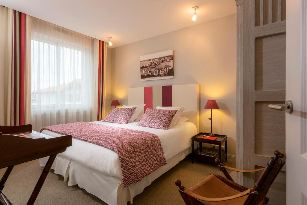 Postel nebo postele na pokoji v ubytování Hôtel La Réserve