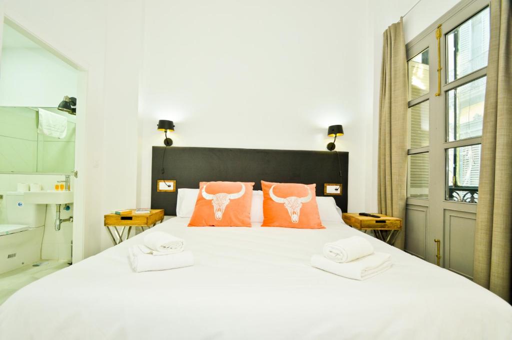 Posteľ alebo postele v izbe v ubytovaní NineSuites