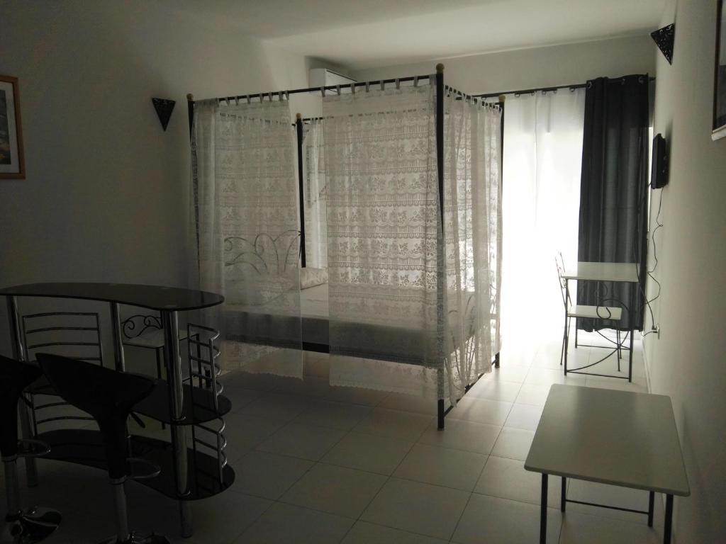 Postel nebo postele na pokoji v ubytování Residencial Casa da Luz