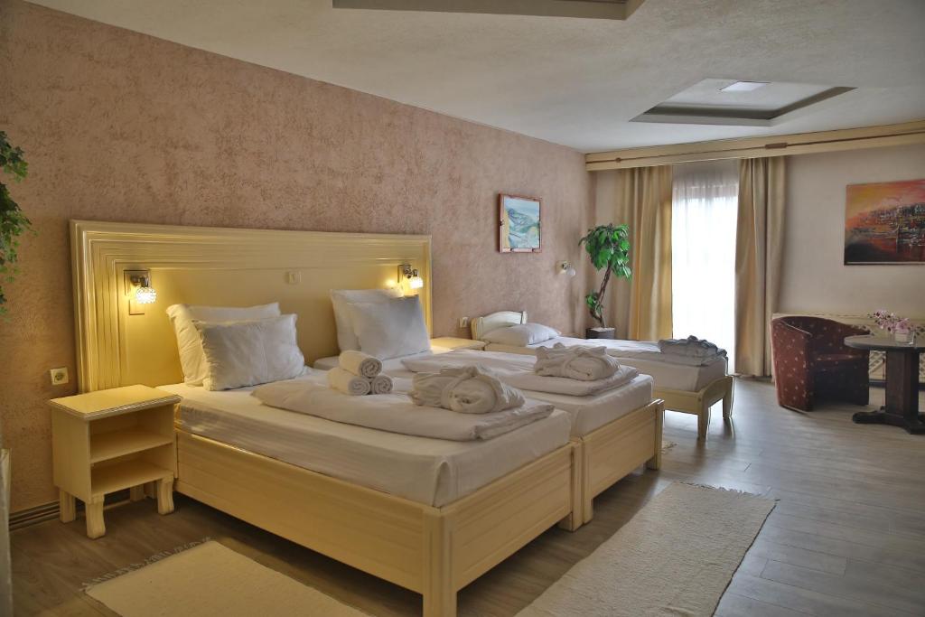 Voodi või voodid majutusasutuse Hotel Centar Balasevic toas
