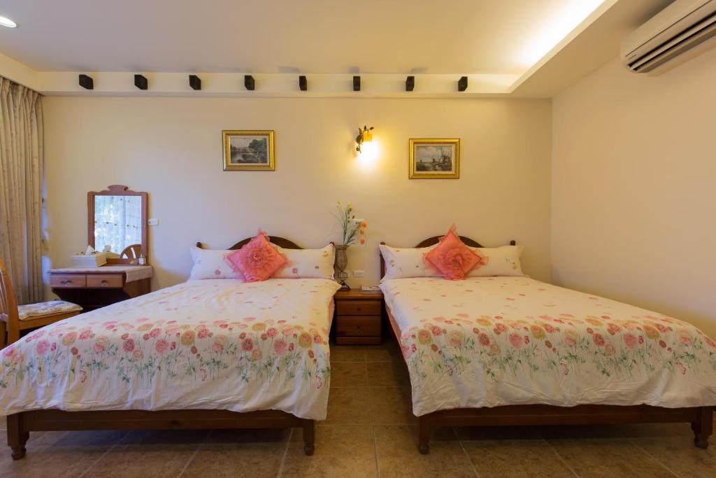 Postel nebo postele na pokoji v ubytování Gengmengyuan B&B