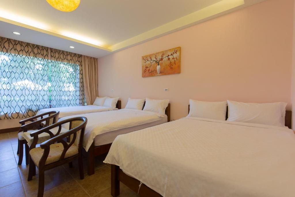 Postel nebo postele na pokoji v ubytování Gengmengyuan B&B
