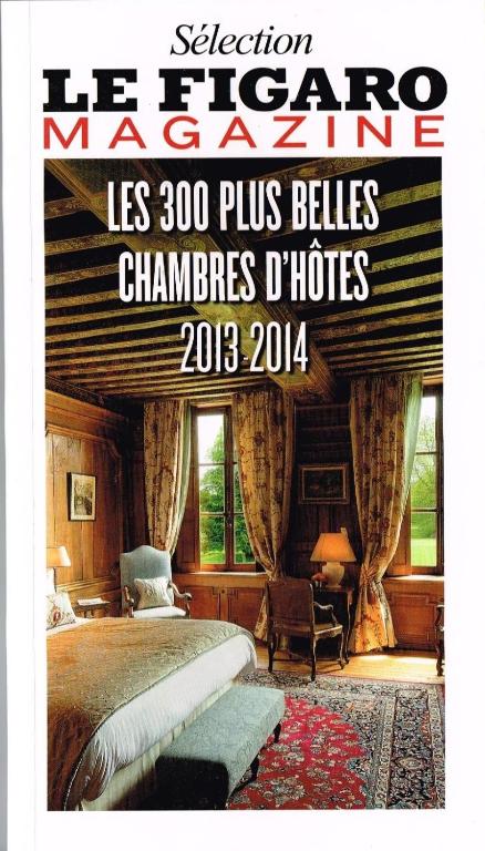 Postel nebo postele na pokoji v ubytování Manoir de l'Isle